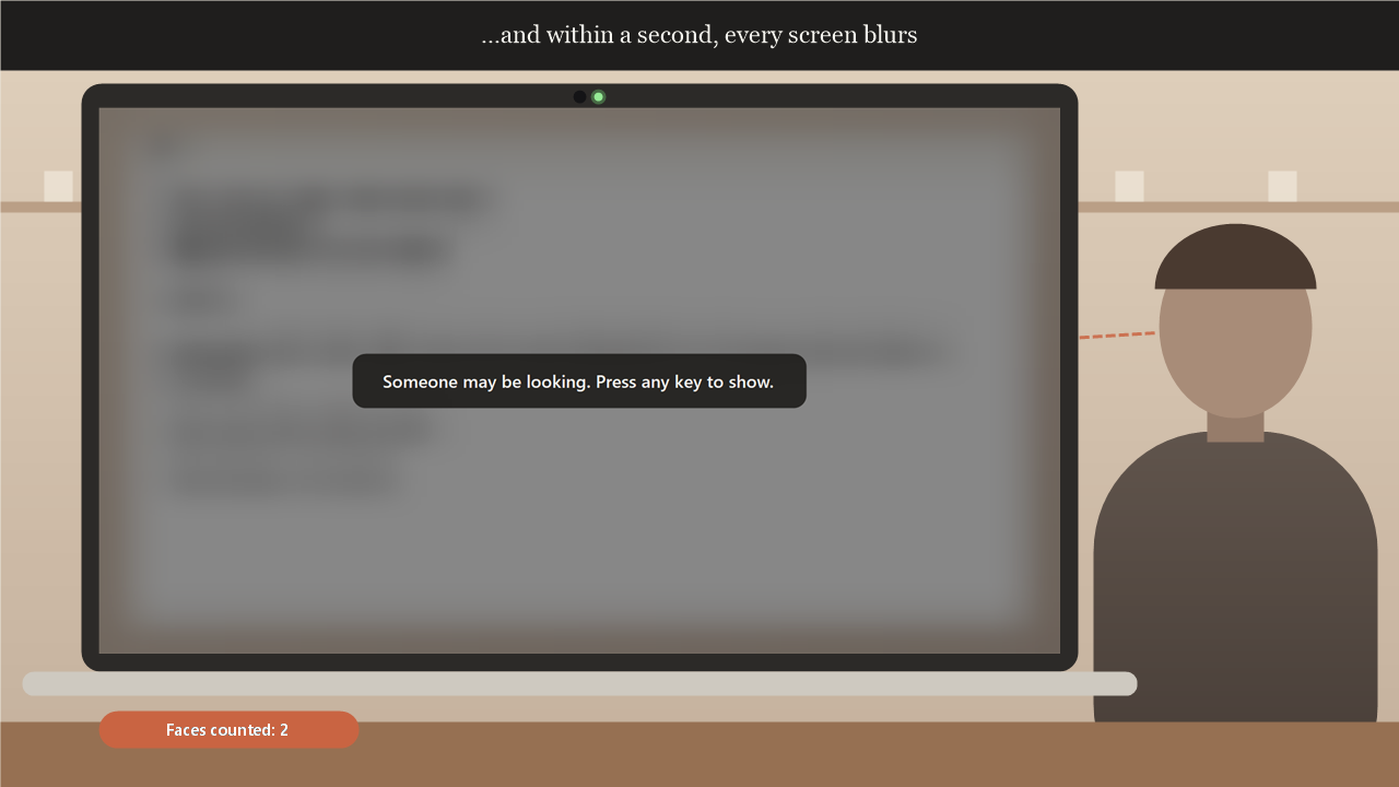 A laptop in a café with its screen blurred and darkened, a message in the middle reading: Someone may be looking. Press any key to show. Someone stands beside the laptop.
